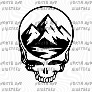 May include: Black and white graphic of a skull with a mountain range inside the skull's head. The text "NORTH AND NINETEEN" is repeated around the image. The design is a unique blend of nature and gothic imagery.