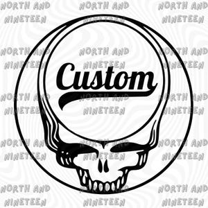 May include: Black and white graphic featuring a skull design within a circular frame. The word "Custom" is written in a stylized font across the center. The words "North and Nineteen" are repeated around the outer edge of the circle.