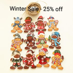 May include: A selection of wooden gingerbread man decorations, each adorned with winter attire such as hats and scarves. The ornaments are brightly coloured and include candy canes. The text "Winter Sale - 25% off" is visible at the top of the image.