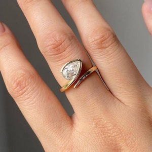 2.00 CT Pear Moissanite Engagement Ring: 14K Yellow Gold Bezel Solitaire.