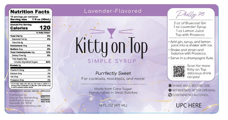 May include: A bottle of "Kitty on Top" lavender-flavored simple syrup, 473 ml, with a cocktail recipe. The label includes nutrition information and the text "Purrfectly Sweet." Made from cane sugar, the syrup is for cocktails and mocktails.