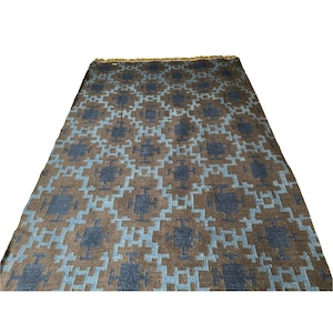 Handwoven wool kilim rug in brown and blue geometric tribal pattern; flatweave, boho living room or bedroom rug.