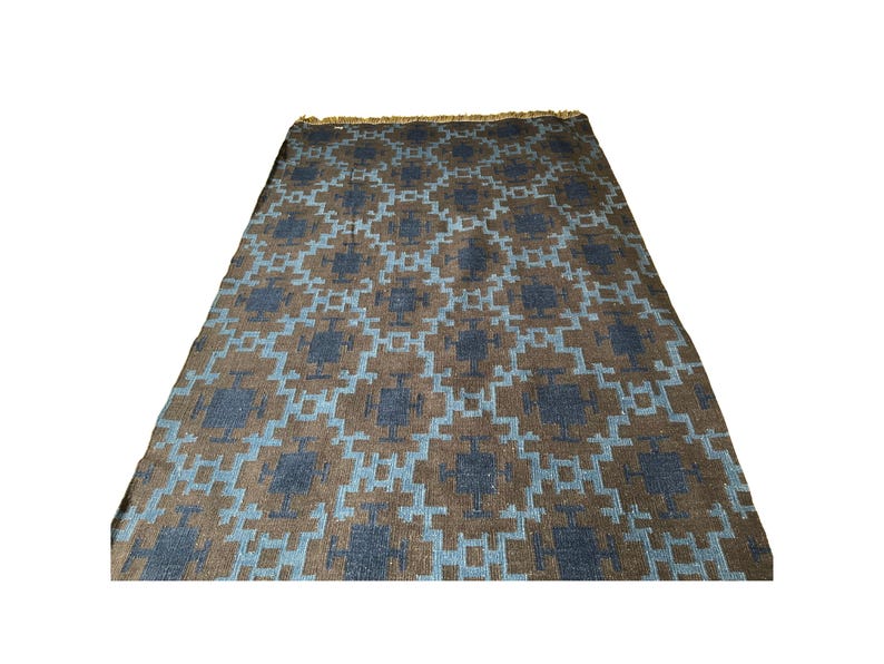 Handwoven wool kilim rug in brown and blue geometric tribal pattern; flatweave, boho living room or bedroom rug.