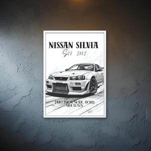 May include: A framed black and white print of a Nissan Silvia S15 2002 car. The print features a detailed illustration of the car with the text "Precision Slide Born Sideways". The print is displayed in a garage setting.