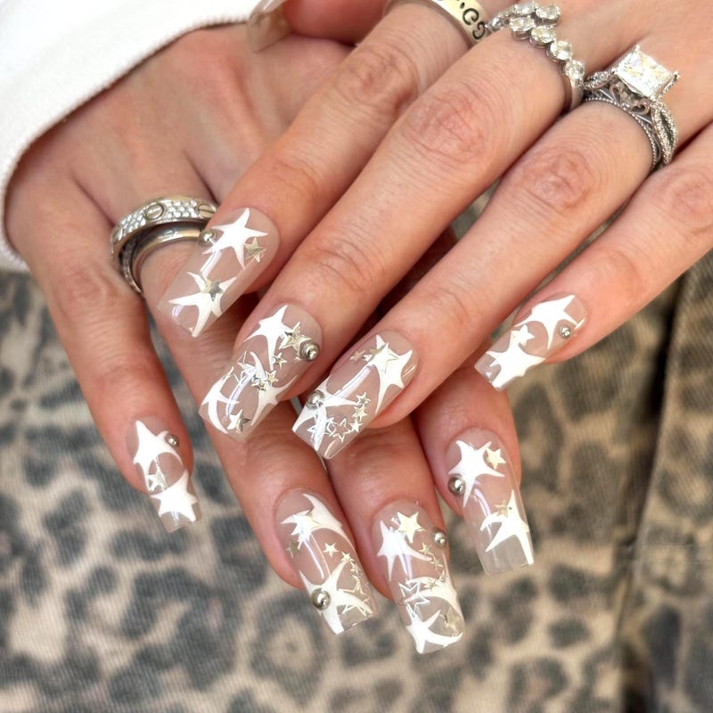 Silver stars on white nails