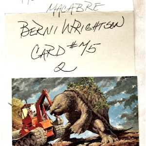 May include: Illustration of a large, turtle-like creature with vegetation on its back, facing an orange tractor. The image is labeled "MASTER OF THE MACABRE" and "BERNI WRIGHTSON CARD #75 2".