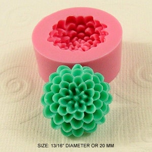 May include: Pink silicone mold for making a 1 3/16 inch diameter or 20 mm green flower. The mold is shown with a finished flower.
