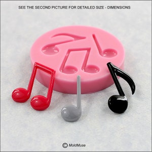 May include: A pink silicone mold with five cavities shaped like musical notes. Three finished resin musical notes are shown in red, gray, and black.