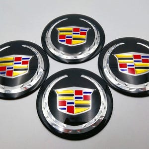 Juego de 4 pegatinas negras para el centro de la rueda de 56 mm para Cadillac. Compatible con Cadillac. Elegante pegatina para coche.