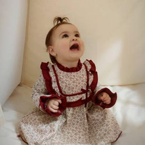 Floral Baby Dress: Vintage-Inspired Cotton Long Sleeve with Burgundy Ruffles