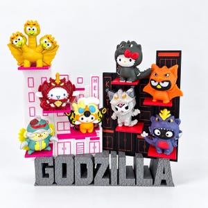 Espositore per Happy Meal di Hello Kitty Godzilla / Scaffale a forma di città per 8 personaggi / Sfondo opzionale con la testa di Godzilla