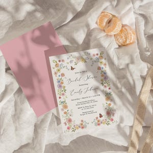 Soft spring garden bridal shower invitation featuring pastel wildflowers and small butterflies along the floral border. A fresh, airy design perfect for spring or summer celebrations and fully customizable for your event.