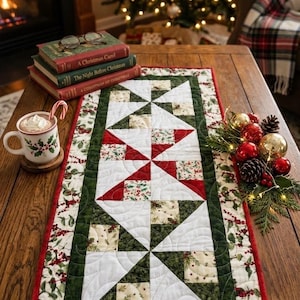 May include: A rectangular quilted table runner featuring a geometric pinwheel pattern in red, white, and green. The fabric displays a festive holly and berry print with a dark green border and a thin red edge, showcasing intricate swirling stitching.
