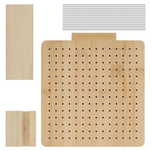 May include: A light-colored bamboo pegboard with numerous small holes, accompanied by wooden pieces and metal rods. The pegboard has a square shape with rounded corners and a small wooden handle at the top. The wooden pieces are rectangular.