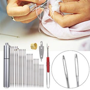 May include: A selection of sewing tools, including needles, a thimble, a seam ripper, and a needle case. The needles are various sizes and made of silver-coloured metal. The seam ripper has a red handle. A person is sewing with a thimble.