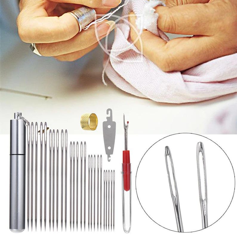 May include: A selection of sewing tools, including needles, a thimble, a seam ripper, and a needle case. The needles are various sizes and made of silver-coloured metal. The seam ripper has a red handle. A person is sewing with a thimble.