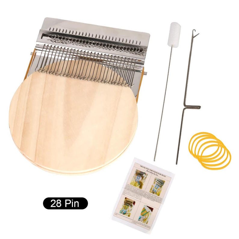 May include: A kalimba instrument with a wooden soundboard and metal tines. The image includes a tuning hammer, cleaning brush, rubber bands, and a small instruction sheet. The text "28 Pin" is visible on the bottom left.