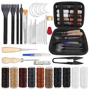 May include: A leathercraft tool kit with various tools, including needles, awls, thread, and a measuring tape. The kit includes a black carrying case, multiple spools of thread in various colors, and a pair of black scissors.