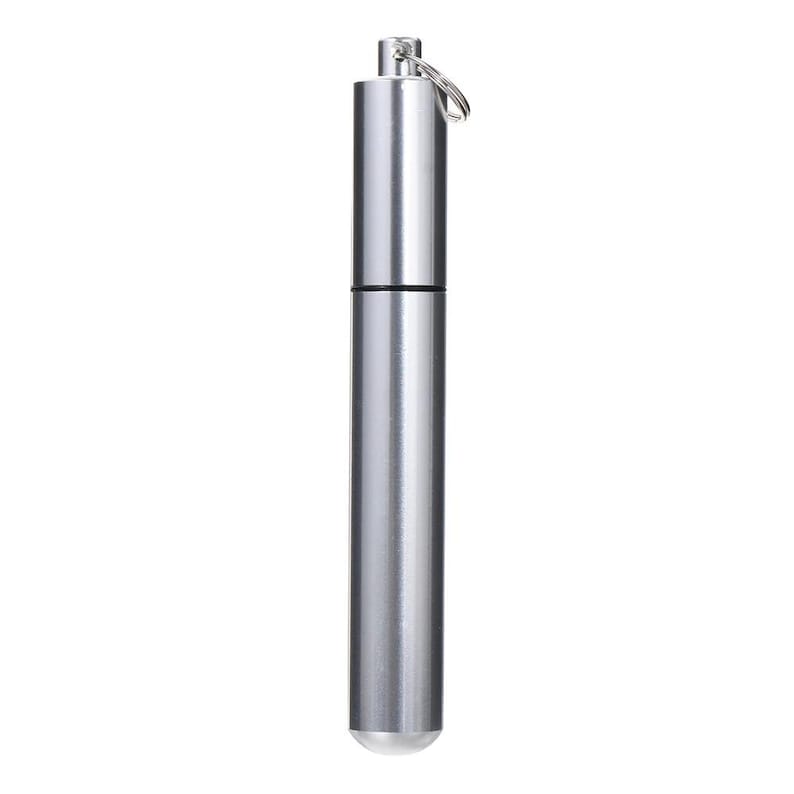 May include: A silver cylindrical container with a keyring attachment. The metal container has a screw-on top and a rounded, white tip. It is designed to hold small items. The container is approximately 10 cm in length.