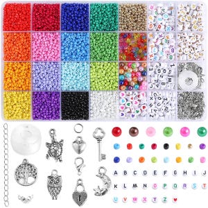 May include: A clear plastic organizer box filled with assorted colorful seed beads, alphabet letter beads, and heart-shaped beads. Below the box are silver-toned metal charms including a turtle, owl, tree, key, lock, and moon, plus loose beads.