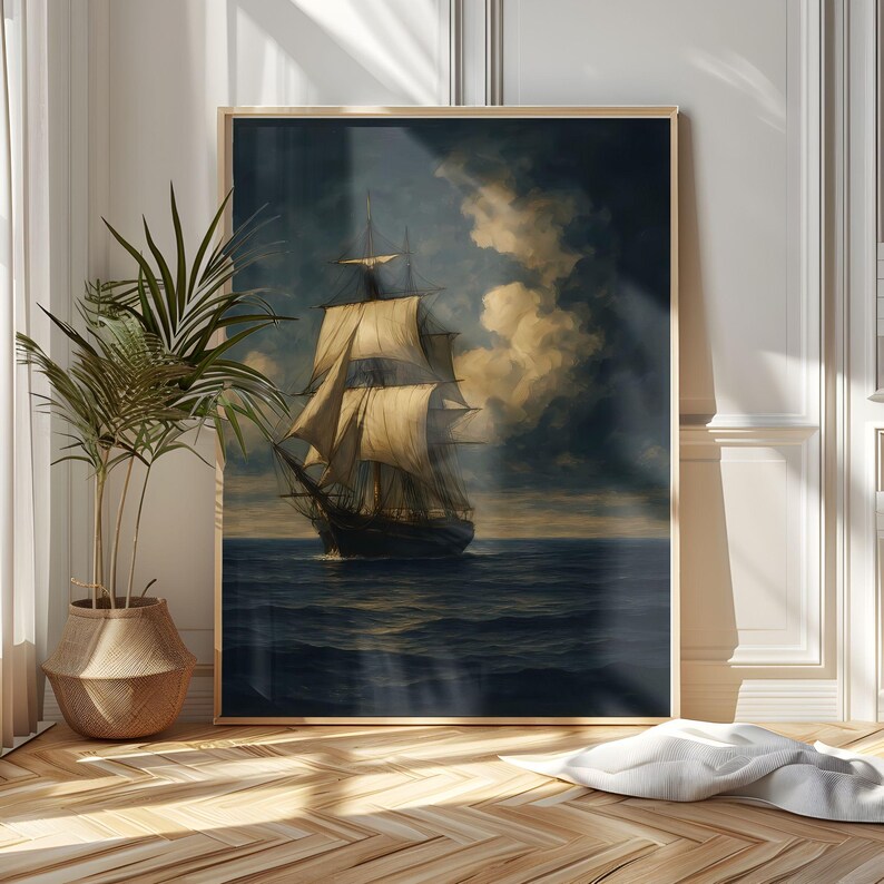 May include: A framed painting of a tall ship sailing on a dark blue sea under a cloudy sky. The ship has multiple sails and is depicted in a classic, vintage style. The artwork is displayed in a room with a potted plant and wooden flooring.
