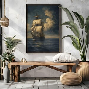 May include: A framed nautical art print depicting a tall ship sailing on a dark blue sea under a cloudy sky. The artwork features a vintage aesthetic with a brown frame, suitable for home decor.