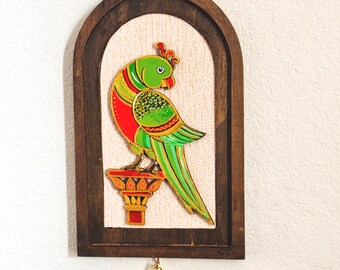 Hand painted relief art - parrot on a wooden arch frame with brass bell (7.5" x 12")