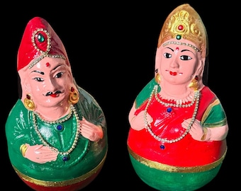 A pair of Thanjavur Dolls- science of gravity