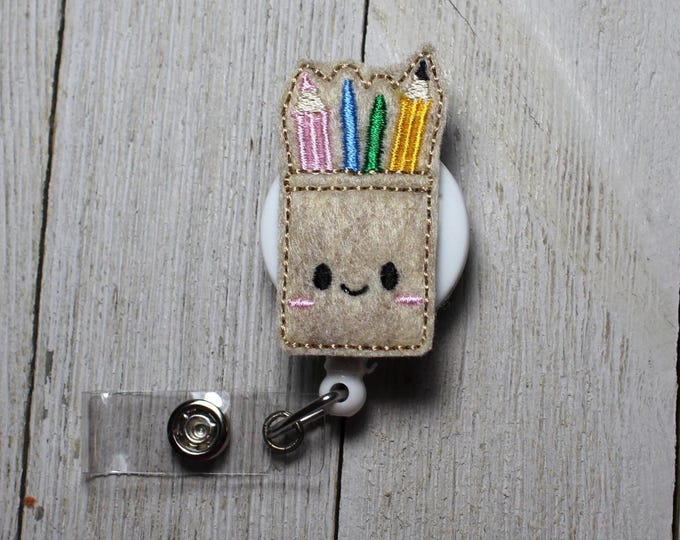 Pencil holder badge holder, retractable reel,  School badge holder