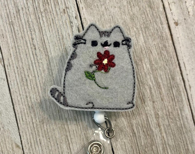 Pudgy cat with flower badge, gray cat with flower ID, gray cat feltie, badge pull