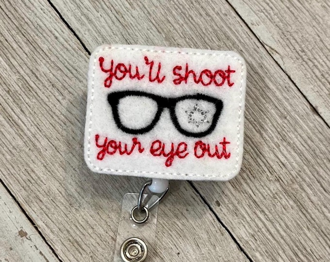 You’ll shoot your eye out badge reel, Christmas story ID holder, you’ll shoot your eye out feltie, badge pull, colored lanyards