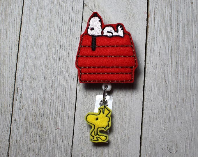 White dog badge holder, retractable reel, cartoon badge, dog on house feltie