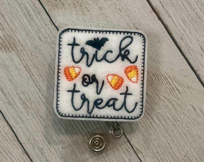 Trick-or-treat badge holder, trick-or-treat Feltie, retractable reel, badge pull