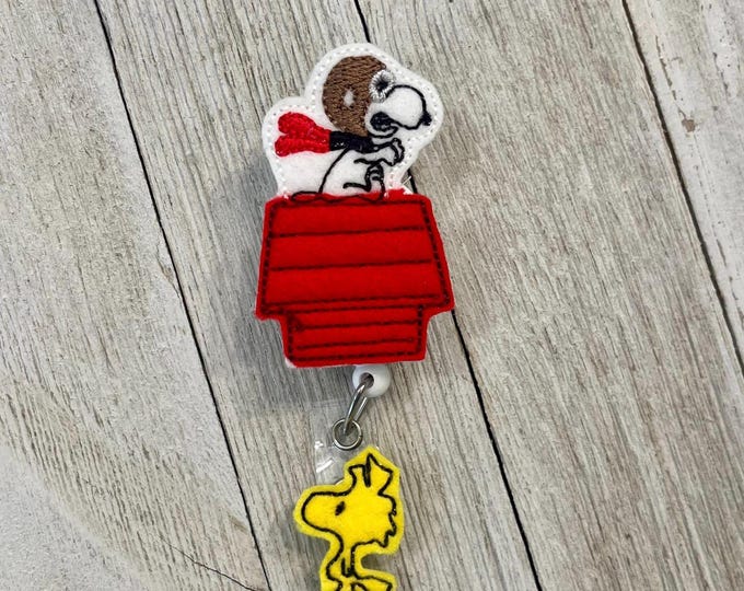 White dong on house badge holder. Dog flying on house, red barren badge holder, dong ok house feltie, badge pull