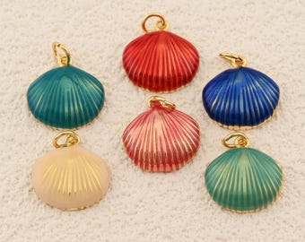 May include: Six colorful seashell charms with gold-tone loops. The charms are in shades of red, pink, blue, teal, and cream. Each shell has a ribbed texture and a gold-colored loop for attaching to jewelry or other crafts.