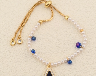 Timeless Pearl Bracelet Designed with Blue Teardrop Charm and Easy Adjustable Sliding Chain 26cm