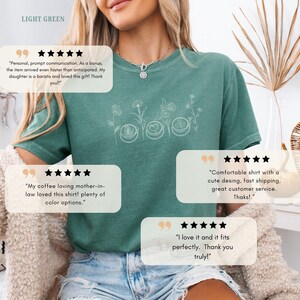 Light green t-shirt mockup with coffee and wildflower illustration. Soft girl aesthetic and botanical lover gift idea.
