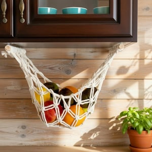 May include: A set of three ceramic mugs with a speckled, matte finish. The mugs are in shades of cream, light gray, and dark gray. Each mug has a simple, minimalist design, perfect for coffee or tea.