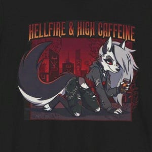 May include: A black t-shirt featuring a graphic illustration of an anthropomorphic wolf character with grey fur, wearing a dark hoodie and pants with a chain. The text HELLFIRE & HIGH CAFFEINE is printed above the character in a stylized font.