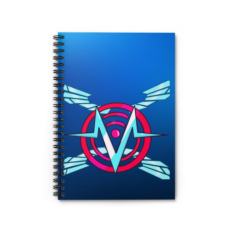 May include: Spiral-bound notebook with a vibrant blue cover featuring a graphic design. The design includes a red circle with a white and pink center, and a stylized 'M' shape. The background is a gradient of blue.