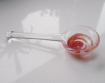 Small glass spoon with red and white pattern