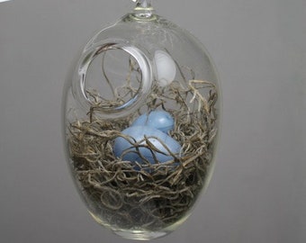 hand blown glass bird nest terrarium with two glass eggs