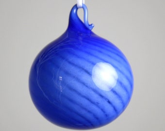 cobalt blue over white blown glass ornament with a twist