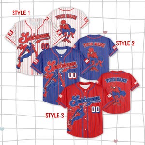 May include: Baseball jerseys in red, white, and blue, featuring the Spider-Man logo and character art. The jerseys have pinstripes and the text "Spiderman" and "00". The back of some jerseys have the text "Your Name".