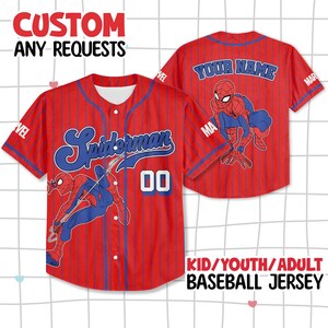 May include: Red baseball jersey with blue pinstripes, featuring the word "Spiderman" in blue script and the number "00". The jersey also has a Spiderman graphic and the text "CUSTOM ANY REQUESTS" and "KID/YOUTH/ADULT BASEBALL JERSEY".