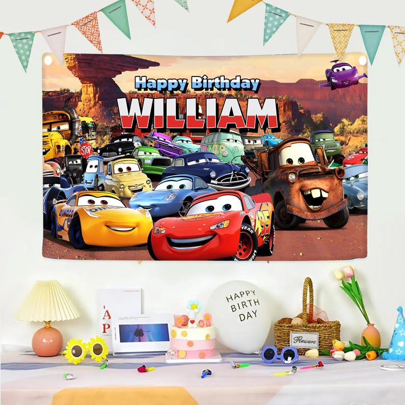 May include: A colorful birthday banner featuring characters from the animated movie Cars, with the text "Happy Birthday WILLIAM". The banner includes images of Lightning McQueen, Mater, and other vehicles, with a desert landscape background.