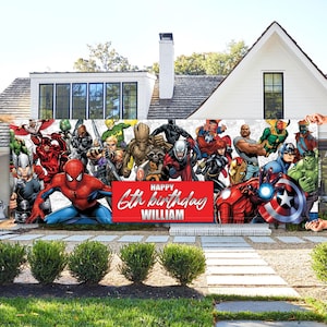 May include: A large banner featuring Marvel superheroes, including Spider-Man, Captain America, and Iron Man. The banner has a red rectangle with the text "HAPPY 6th birthday WILLIAM". The banner is displayed in front of a white house with green bushes.