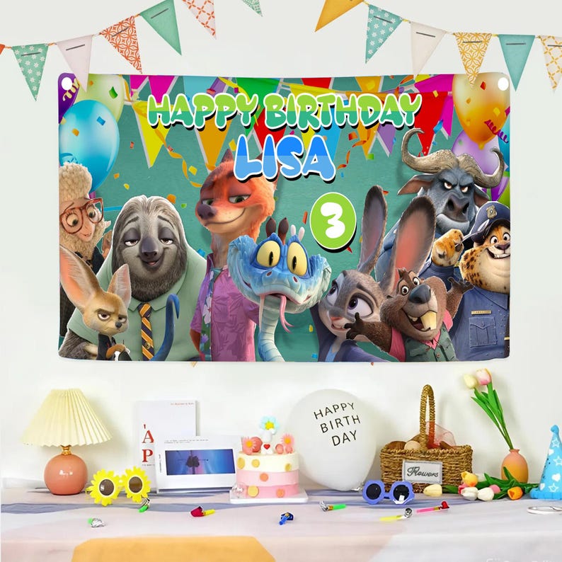 May include: A rectangular birthday banner featuring Zootopia characters, the text HAPPY BIRTHDAY LISA, and a green circle with the number 3. The banner is decorated with colorful balloons and bunting, displayed above a table with party supplies.