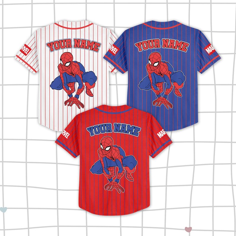 May include: Three baseball jerseys in red, white, and blue, each featuring a Spider-Man graphic. The jerseys have vertical stripes and the text "YOUR NAME" across the back. The Marvel logo is visible on the sleeves.
