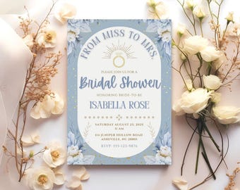 May include: A light blue bridal shower invitation with floral accents and gold details. The invitation reads "From Miss to Mrs." and includes the bride's name, date, time, and location.